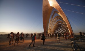 Light is reflected from the Temple of Promise during the Burning Man 2015 "Carnival of Mirrors" arts and music festival in the Black Rock Desert of Nevada
